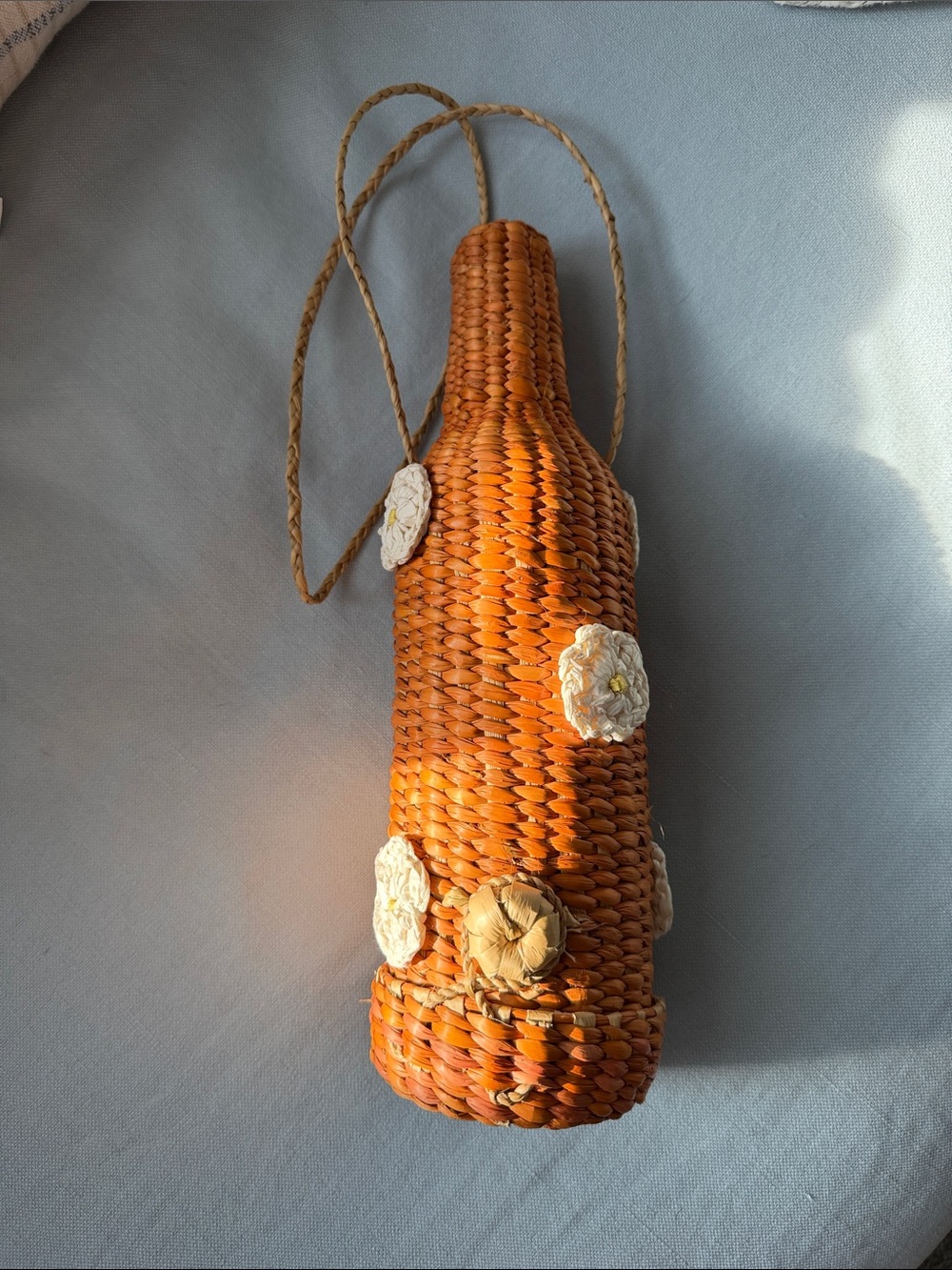 Handwoven Orange Bottle-Shaped Basket Bag with Floral Accents